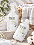 Parfum de linge Wash·Up Radiant Orchid 500 ml présenté avec vaporisateur et flacon dans une ambiance élégante et lumineuse.